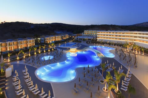 Indoor pool, outdoor pool, open 10:00 AM to 6:00 PM, pool umbrellas