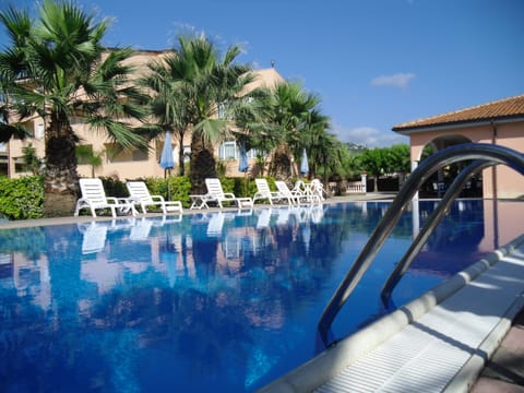 Seasonal outdoor pool, open 9:00 AM to 8:00 PM, sun loungers