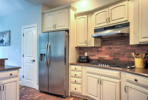 Kitchen is outfitted with a Gas Cooktop