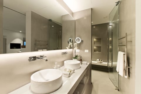 Shower, designer toiletries, hair dryer, bathrobes