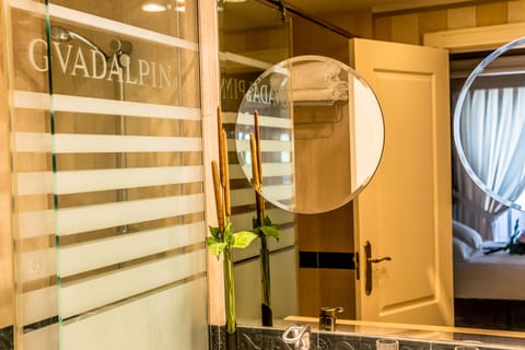 Bathtub, designer toiletries, hair dryer, bidet