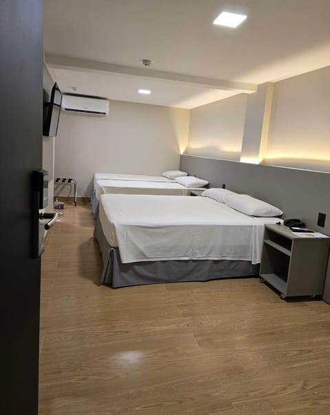 Deluxe Quadruple Room | Minibar, free WiFi, bed sheets