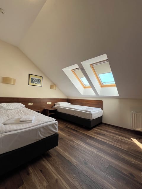 Attic Twin Room | Hypo-allergenic bedding, in-room safe, desk, blackout drapes