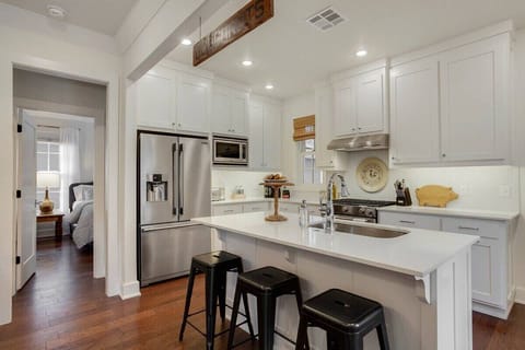 Woo-pig sooie! Our beloved Arkansas Razorbacks even make an appearance in the SoFay Farmhouse. Directly behind the kitchen is the master bedroom, which you'll see next!