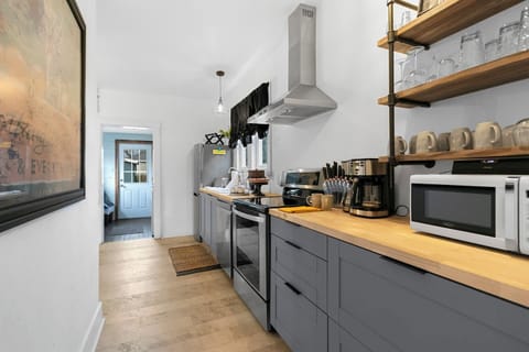 A galley kitchen with everything you need + extra seating and a selfie wall!.