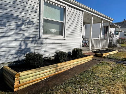 New flowerbeds and landscaping. The roof and siding has since been updated.