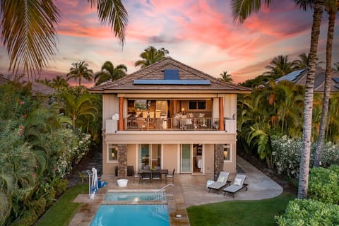 Private pool and spa overlooking the Francis H. Brown North Golf Course, glowing at sunset.