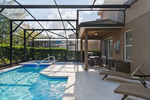 Large pool area with elegant décor, perfect for outdoor relaxation.
