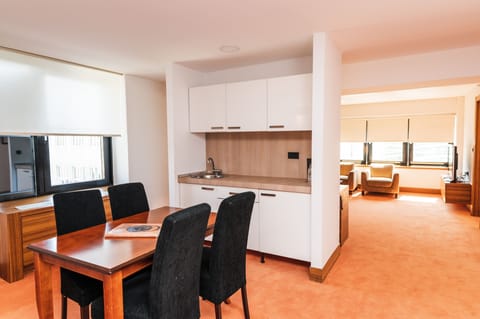 Deluxe Apartment, City View | Living area | TV