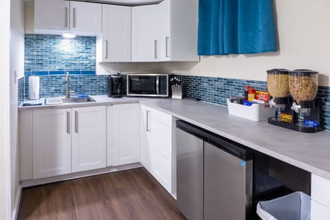The kitchenette adds great functionality to the space with many amenities.
