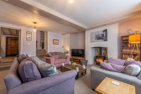 Greyhound Cottage, Sculthorpe: Sitting room with wood burning stove