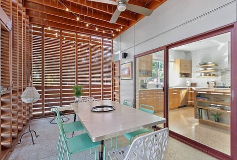 Bring your meals outside! The second of our home's 3 outdoor living spaces! Enjoy a beautiful indoor-outdoor patio space attached to the home's kitchen. Behind the outdoor dining table enjoy 2 side chairs for sipping morning coffee or evening wine.