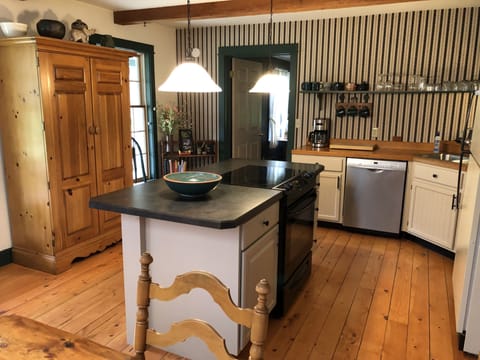 Spacious country kitchen for cooking relaxing and enjoying friends.