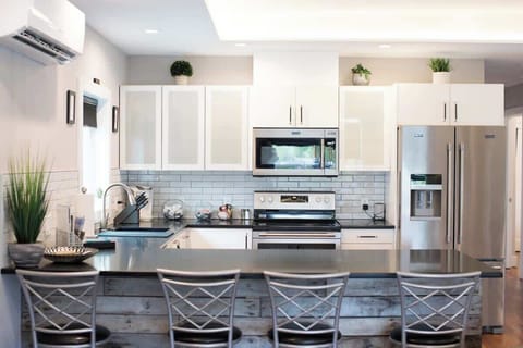 Peninsula seating makes meal prep and conversation easy.