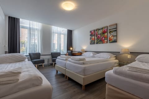 Classic Quadruple Room, Private Bathroom | Individually furnished, desk, iron/ironing board, free WiFi