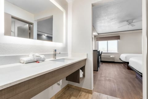 Standard Room, 2 Queen Beds | Bathroom | Combined shower/tub, free toiletries, hair dryer, towels