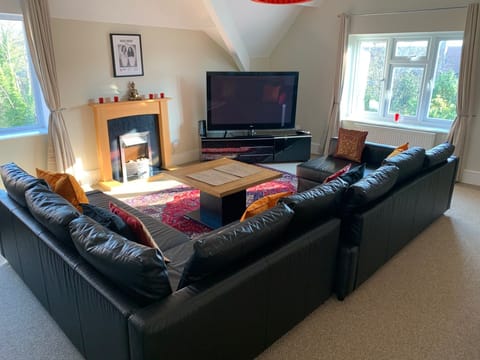 Large lounge with double sofa bed and 60" TV, DVD and Xbox.