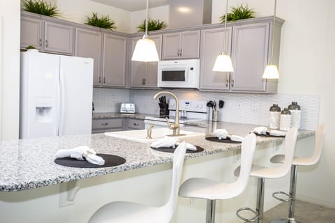 Townhome, 4 Bedrooms | Private kitchenette | Full-size fridge, microwave, oven, stovetop