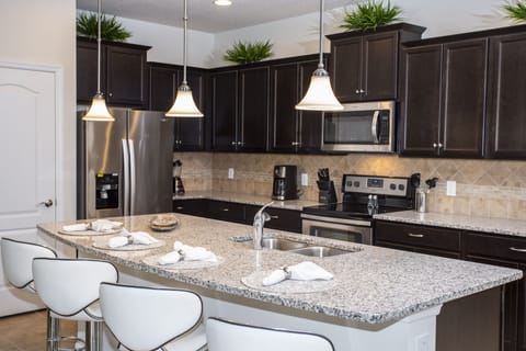 Townhome, 5 Bedrooms | Private kitchenette | Full-size fridge, microwave, oven, stovetop