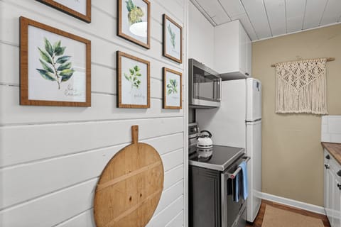 Cozy kitchen with all of the appliances needed to make a wonderful home cooked meal.