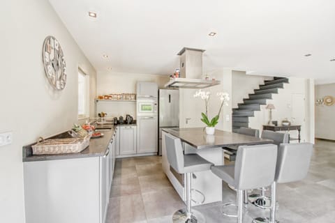 Villa | Private kitchen | Fridge, highchair