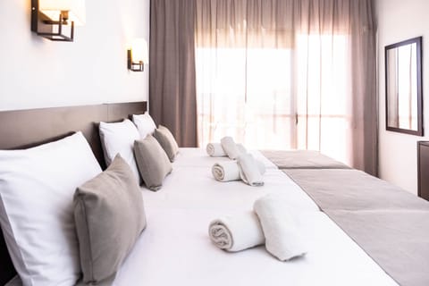 Standard Triple Room, 3 Twin Beds | In-room safe, desk, laptop workspace, bed sheets