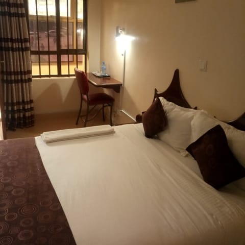 Deluxe Room | Desk, blackout drapes, iron/ironing board, free WiFi