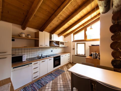 Cabinetry, Countertop, Property, Wood, Kitchen, Sink, Kitchen Stove, Lighting, Interior Design, Drawer