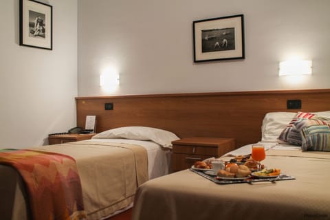 Standard Double or Twin Room | Minibar, in-room safe, desk, blackout drapes