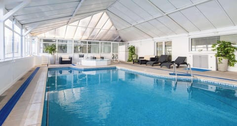 Indoor pool, seasonal outdoor pool, pool umbrellas, sun loungers