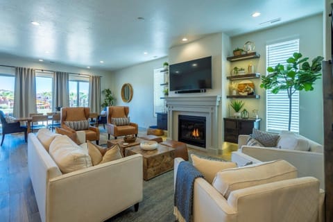 Main floor living room with ample seating for large groups