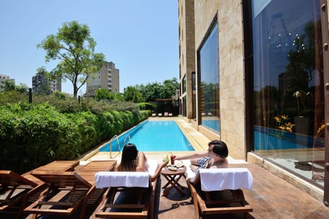 Seasonal outdoor pool, pool umbrellas, sun loungers