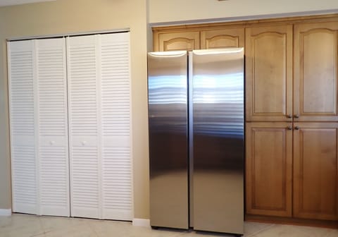 Full size washer/dryer closet, new side by side refrigerator and large pantry.
