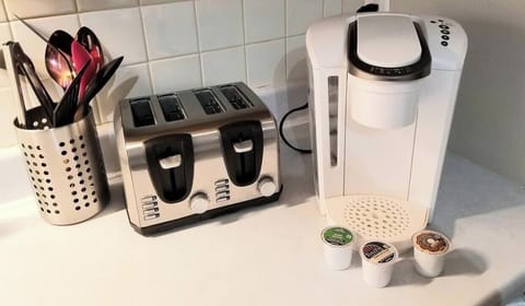 Keurig coffee maker & coffee pods. Toaster and kitchen utensils. 
