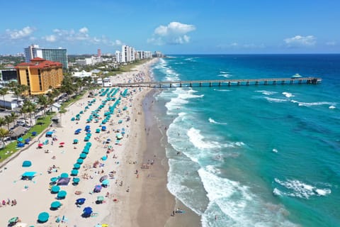 Beach nearby, white sand, sun loungers, beach umbrellas