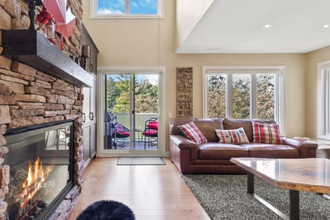Deluxe Condo, 3 Bedrooms (204 Sierra Lane - No Pets Allowed) | Living area | 50-inch LED TV with cable channels, TV, fireplace