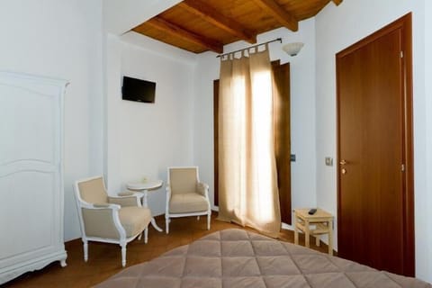 Basic Double Room | Living area | 29-inch LCD TV with satellite channels, TV