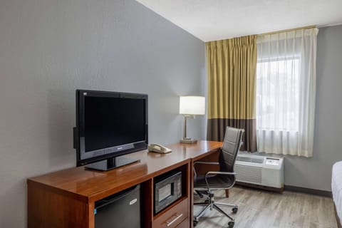 Desk, laptop workspace, blackout drapes, iron/ironing board