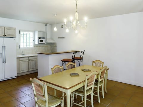 Furniture, Cabinetry, Property, Table, Chair, Countertop, Wood, Lighting, Interior Design, Kitchen & Dining Room Table