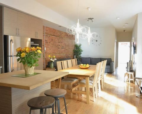 The dining table sits 10 people and the kitchen island sits 2 people.