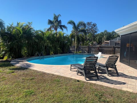 Catch some Vitamin D by the pool!  Lush tropical oasis!