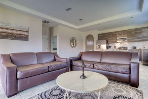 Spacious Living Area w/Leather Sofas, Wall Mounted TV and Pool Access
