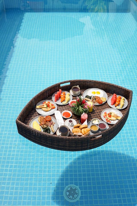 Outdoor pool, open 7:00 AM to 9:00 PM, pool umbrellas, sun loungers