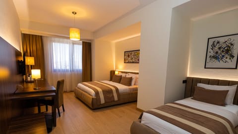 Standard Twin Room | Minibar, in-room safe, desk, soundproofing