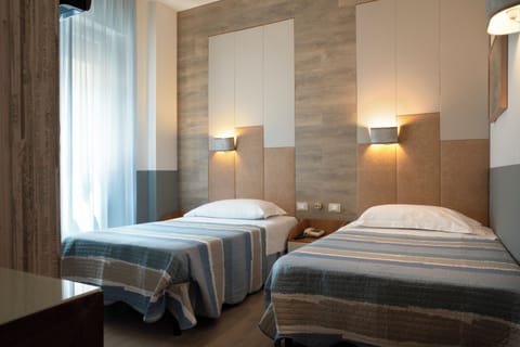 Classic Twin Room | Minibar, in-room safe, desk, soundproofing