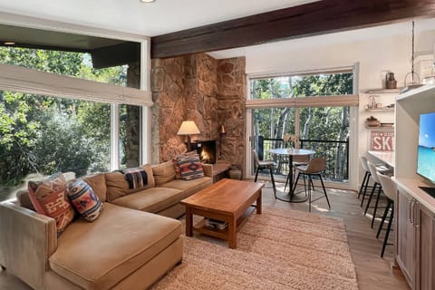 The spacious living area is filled with light from the large floor to ceiling windows!