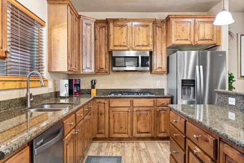 The spacious kitchen has everything your group needs for delicious meals.