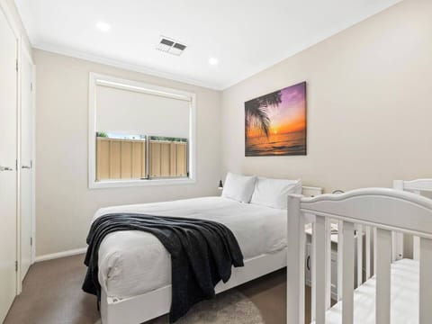 Bedroom 3 complete with queen bed & full size cot. The cot has a drop down side.