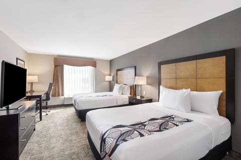 Desk, blackout drapes, iron/ironing board, free cribs/infant beds