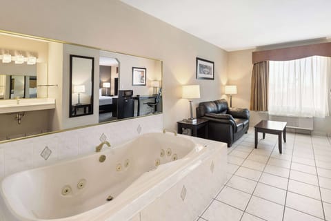 Suite, 1 King Bed, Non Smoking, Jetted Tub | Desk, blackout drapes, iron/ironing board, free cribs/infant beds